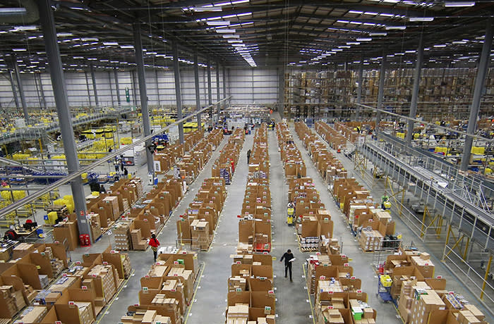HEMEL HEMPSTEAD, ENGLAND - DECEMBER 05: Parcels are prepared for dispatch at Amazon's warehouse on December 5, 2014 in Hemel Hempstead, England. In the lead up to Christmas, Amazon is experiencing the busiest time of the year. (Photo by Peter Macdiarmid/Getty Images)